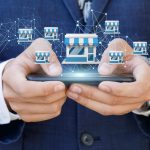 Businessman showing Franchise system on a mobile device.